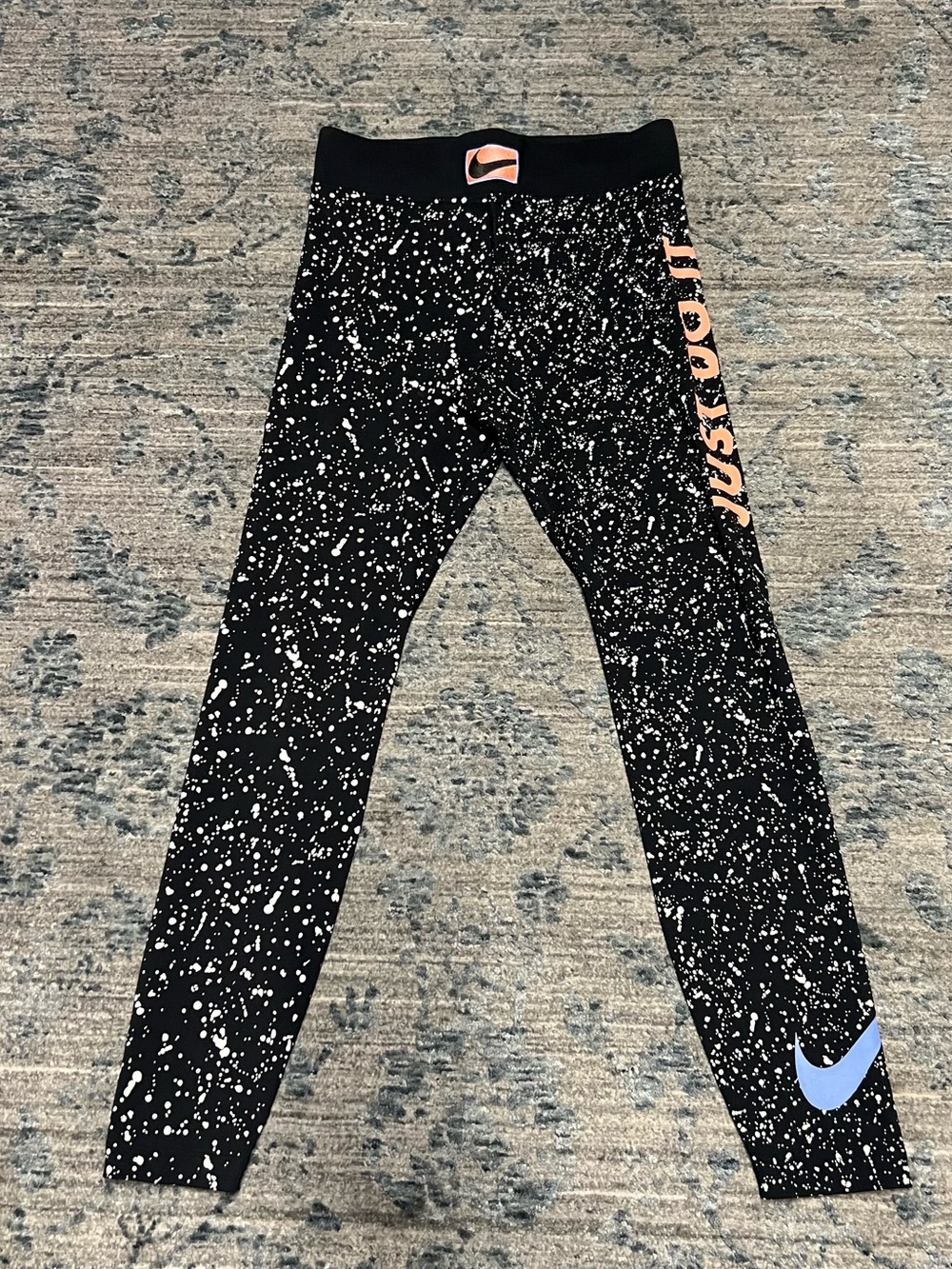 Nike Black Splatter Leggings with Peach Accent and Light Blue Swoosh